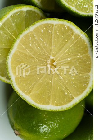 Juicy Green Lime Halves in Macro View 125798212