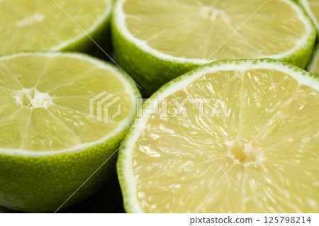 Juicy Green Lime Halves in Macro View 125798214