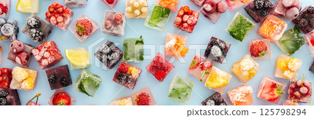 Ice cubes with frozen berries and fruits Ice cubes with frozen berries and fruits 125798294