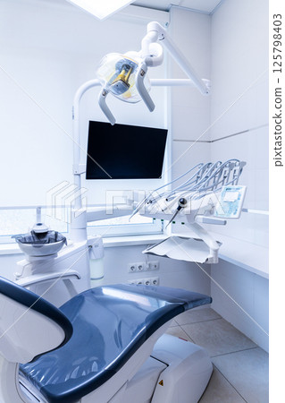 Modern Dental Treatment Room with Advanced Equipment and Technology Designed to Enhance Patient Comfort and Ensure Efficient Dental Procedures and Treatments in a Clean Environment 125798403