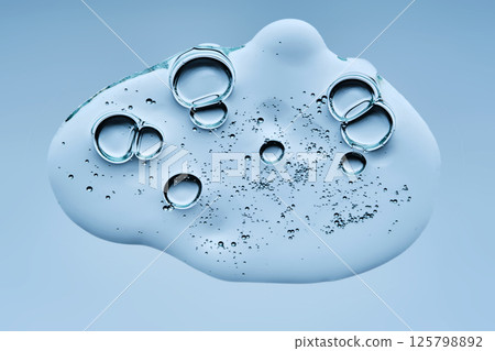 A drop of gel serum with bubbles. The texture. View from below. 125798892