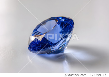 Blue sapphire gemstone on white background Blue sapphire gemstone on white background 125799114