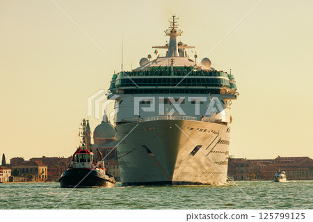 Cruise ship and tugboat in the venetian lagoon, Italy. Cruise ship and tugboat in the venetian lagoon, Italy. 125799125