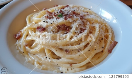 Creamy spaghetti carbonara with bacon, cheese, and pepper. Creamy spaghetti carbonara with bacon, cheese, and pepper. 125799393
