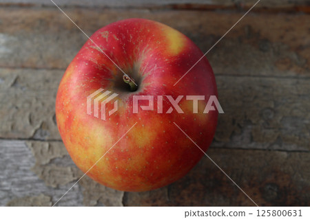 Ripe apple of the Honey Crisp variety. Ripe apple of the Honey Crisp variety. 125800631