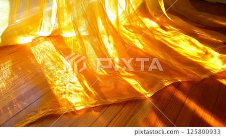 Golden Sheer Fabric Draped on Wooden Floor Sunlight ray art warm soft beam home 125800933