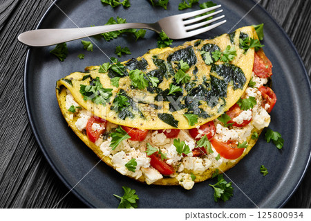 Spinach Onion Goat Cheese Cherry Tomato Omelette Spinach Onion Goat Cheese Cherry Tomato Omelette 125800934