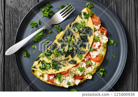 Spinach Onion Goat Cheese Cherry Tomato Omelette 125800936