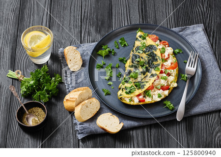 Spinach Onion Goat Cheese Cherry Tomato Omelette 125800940