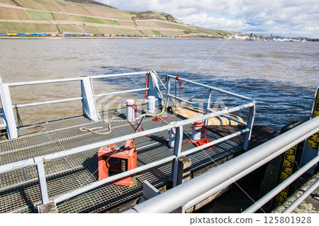 Ferry boat on the water near with port. The transportation on the sea, river, ocean. Ferry boat on the water near with port. The transportation on the sea, river, ocean. 125801928