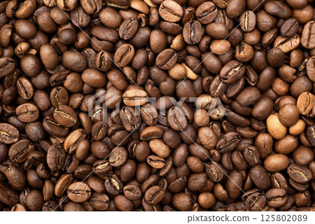 Textured background of freshly roasted coffee beans 125802089