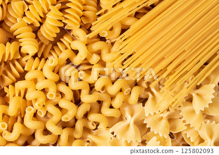 Variety of types and shapes of dry Italian pasta. Layout of Italian raw pasta, top view 125802093