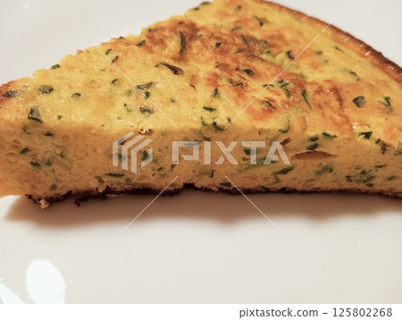 omelette with onions and courgettes 125802268