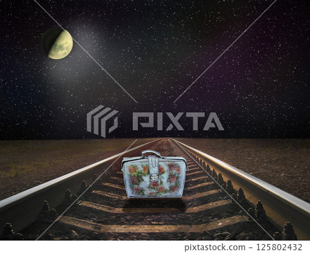 View of rails and moon at night. Night railway road. Night travel 125802432