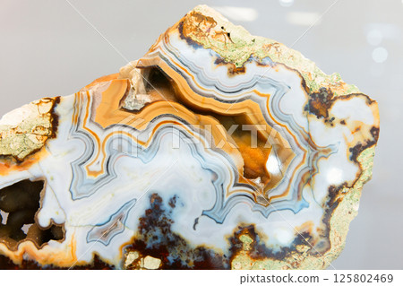 Banded agate mineral specimen, close up photo 125802469
