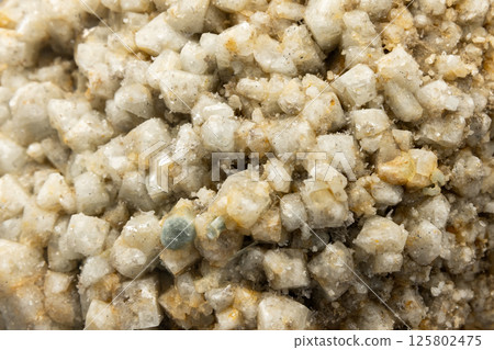 Detailed macro photograph of white topaz mineral crystals 125802475