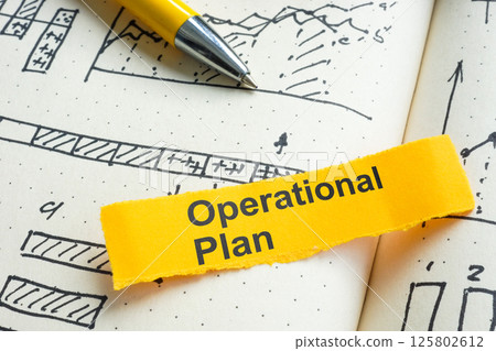 Operational plan notebook with charts. Business strategy concept. 125802612