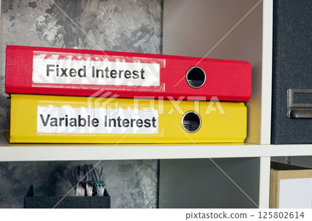 Folders labeled fixed and variable interest. Loan management. 125802614