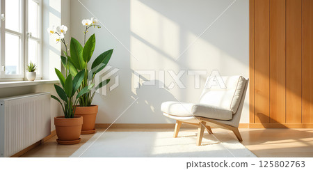 Armchair in a modern minimalist interior against an empty white wall Armchair in a modern minimalist interior against an empty white wall 125802763
