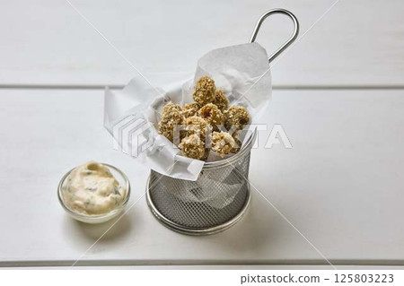 Crispy Breaded Olives with Dipping Sauce 125803223