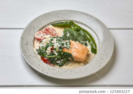 Creamy Salmon with Spinach, Tomato, and Basil 125803227