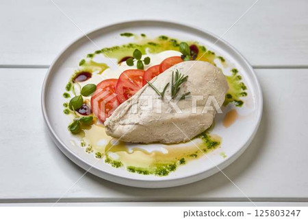 Poached Chicken Breast with Tomato and Herbs Poached Chicken Breast with Tomato and Herbs 125803247
