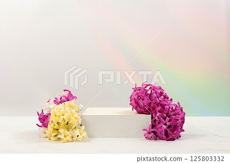 Abstract beautiful flower arrangement with hyacinths,banner.Empty product podium and fresh live spring flowers.Stage for business concept.Minimal modern aesthetics and elegant beauty concept 125803332