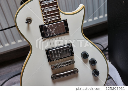 White electric guitar White electric guitar 125803931