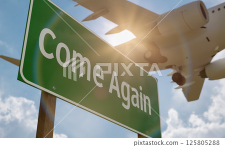 Come Again Green Road Sign with Low Flying Airplane Just Above with Landing Gear Down. Come Again Green Road Sign with Low Flying Airplane Just Above with Landing Gear Down. 125805288