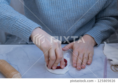 Workshop cutting figures Children air dry clay activity handicraft idea. DIY process step by step instruction. Preparing for Christmas tree holiday decorating. Modern organic design minimalistic 125805616