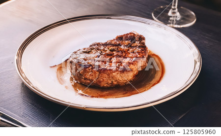 Close-up of a juicy steak / Appetizing and luxurious food image Close-up of a juicy steak / Appetizing and luxurious food image 125805960