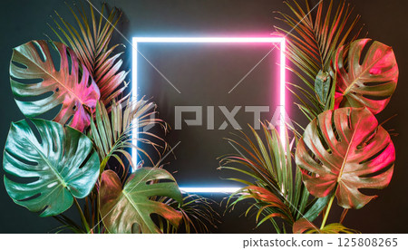Vibrant tropical leaves surround glowing neon frame, creating striking contrast against dark background. colorful lighting enhances lush greenery, evoking modern, tropical atmosphere Vibrant tropical leaves surround glowing neon frame, creating striking contrast against dark background. colorful lighting enhances lush greenery, evoking modern, tropical atmosphere 125808265
