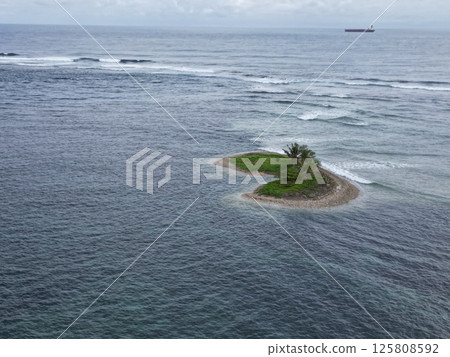 Aerial view of a beautiful islet off the coast of Apia, the capital of Samoa 125808592