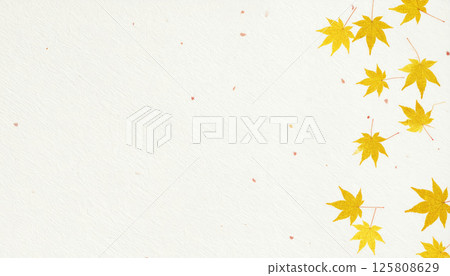 Golden autumn leaves gracefully fall on textured washi paper, creating serene and warm atmosphere. soft hues evoke sense of tranquility and seasonal beauty 125808629