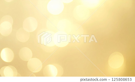 Soft focus creamy gold abstract background with shimmering highlights creates warm and inviting atmosphere, perfect for adding touch of elegance to any design project 125808653