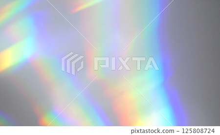 Ethereal light beams and sparkles create soft focus abstract image with rainbow glow, evoking fantasy mood and sense of wonder Ethereal light beams and sparkles create soft focus abstract image with rainbow glow, evoking fantasy mood and sense of wonder 125808724