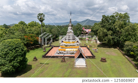 Aerial view of sacred pagoda enshrined the Buddha's relics in Wat Phra Fang temple in Uttaradit province of Thailand. Aerial view of sacred pagoda enshrined the Buddha's relics in Wat Phra Fang temple in Uttaradit province of Thailand. 125808907