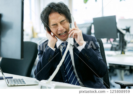 Man experiencing customer harassment Man experiencing customer harassment 125808959