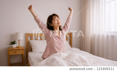 Photo-style material: A woman waking up refreshed in the morning 125809311