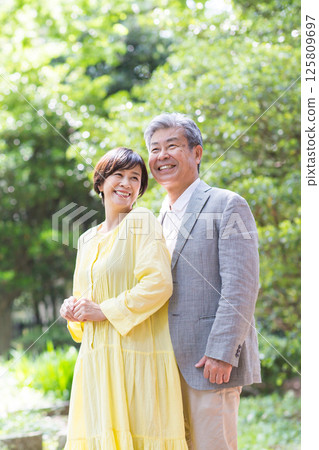 Senior couple enjoying the fresh greenery, couple, middle-aged, date, walk Senior couple enjoying the fresh greenery, couple, middle-aged, date, walk 125809697