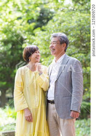 Senior couple enjoying the fresh greenery, couple, middle-aged, date, walk 125809720