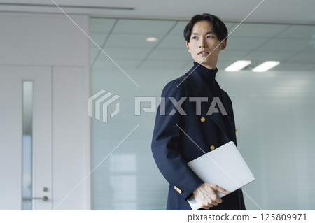 A businessman in his 30s with a laptop A businessman in his 30s with a laptop 125809971