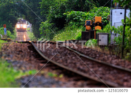 The San'in Line heading towards the undulating Kayodo Straight 125810070