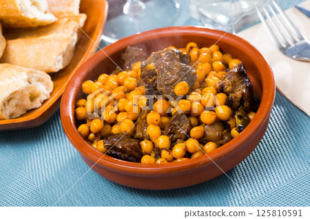 Tasty beef stew with chickpeas closeup 125810591