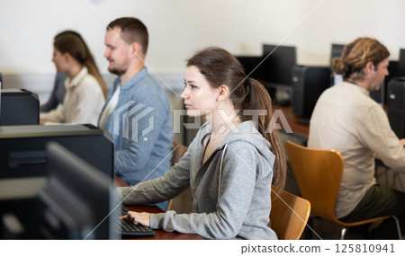 Female student at computers in university computer class 125810941