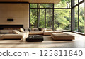 Modern Living Room with Fireplace and Large Windows Overlooking a Forest 125811840