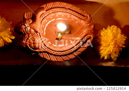 Lighted Oil Lamp and Flowers 125812914
