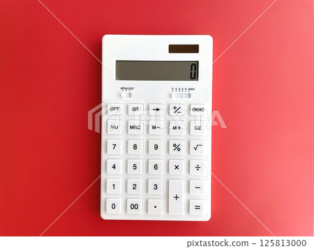 White calculator on a red background 125813000