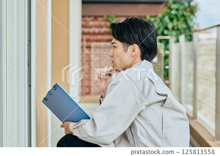 A young man in his 20s checking A young man in his 20s checking 125813558