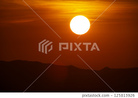 The summer evening, the sunset was still shining in the sky. 125813926